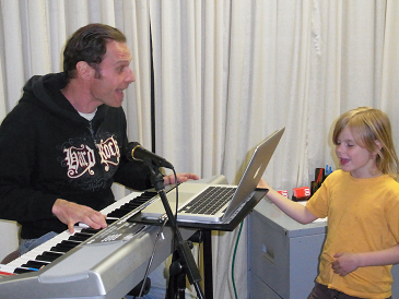 Peter Vox teaching a young student harmonies